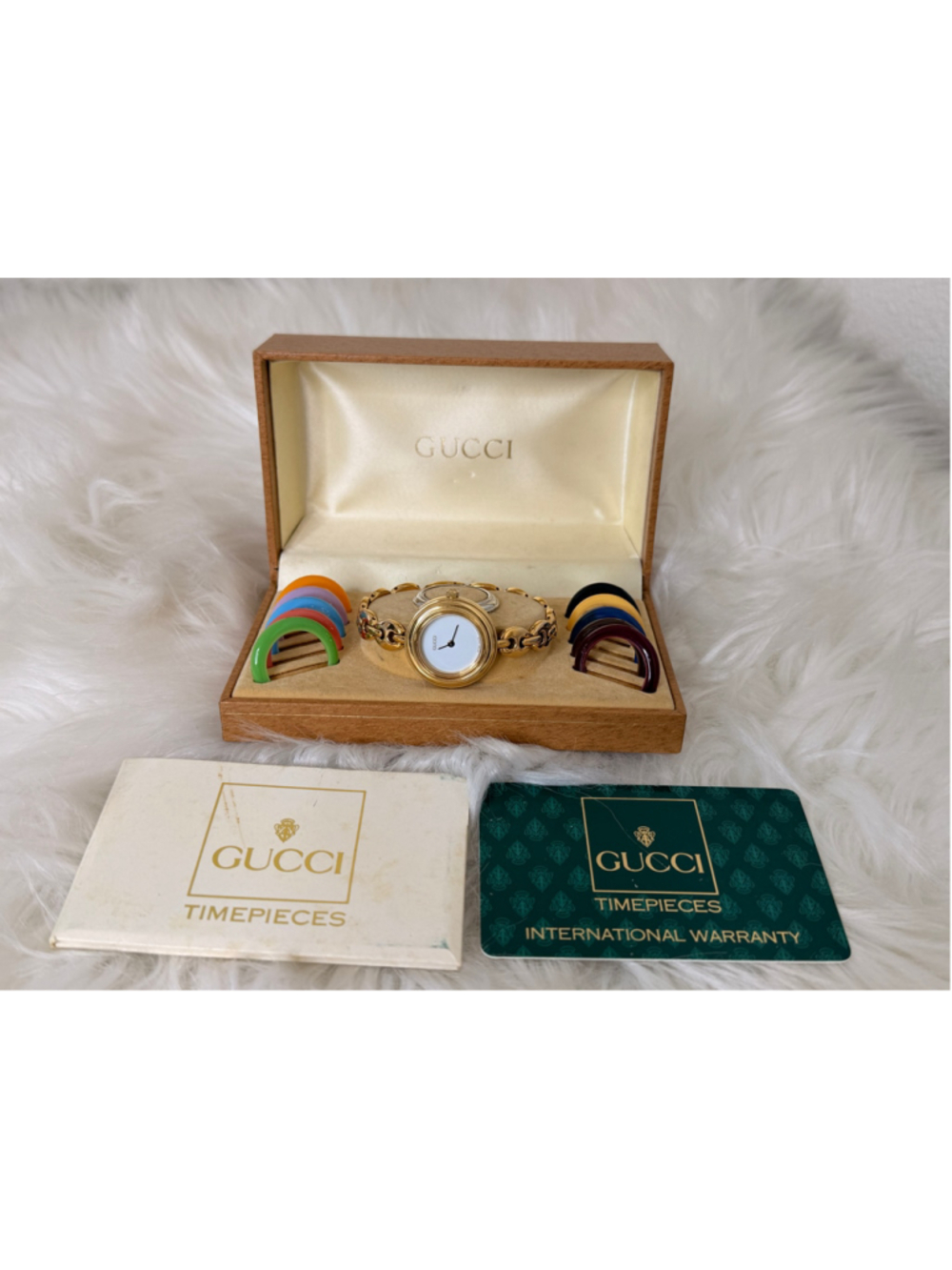 Gucci Interchangeable Bezel Horsebit link Watch, w/ 12 bezels, box & paperwork